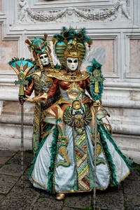 The parade of people in costume at the 2026 Venice Carnival in front of the Church of San Zaccaria.