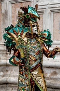 The parade of people in costume at the 2026 Venice Carnival in front of the Church of San Zaccaria.