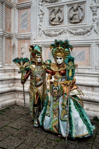 The parade of people in costume at the 2026 Venice Carnival in front of the Church of San Zaccaria.