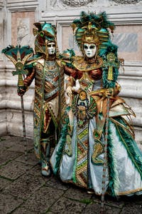 The parade of people in costume at the 2026 Venice Carnival in front of the Church of San Zaccaria.
