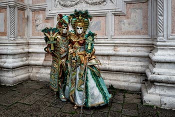 The parade of people in costume at the 2026 Venice Carnival in front of the Church of San Zaccaria.