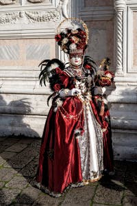 The parade of people in costume at the 2026 Venice Carnival in front of the Church of San Zaccaria.