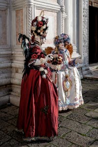 The parade of people in costume at the 2026 Venice Carnival in front of the Church of San Zaccaria.