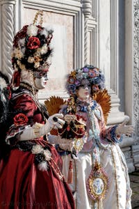 The parade of people in costume at the 2026 Venice Carnival in front of the Church of San Zaccaria.
