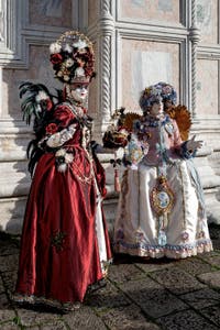 The parade of people in costume at the 2026 Venice Carnival in front of the Church of San Zaccaria.