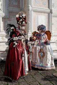The parade of people in costume at the 2026 Venice Carnival in front of the Church of San Zaccaria.