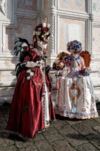The parade of people in costume at the 2026 Venice Carnival in front of the Church of San Zaccaria.