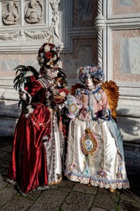 The parade of people in costume at the 2026 Venice Carnival in front of the Church of San Zaccaria.
