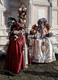 The parade of people in costume at the 2026 Venice Carnival in front of the Church of San Zaccaria.