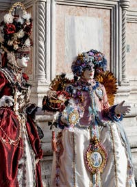 The parade of people in costume at the 2026 Venice Carnival in front of the Church of San Zaccaria.