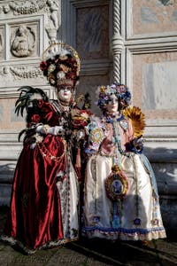 The parade of people in costume at the 2026 Venice Carnival in front of the Church of San Zaccaria.