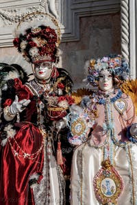 The parade of people in costume at the 2026 Venice Carnival in front of the Church of San Zaccaria.