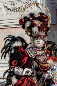 The parade of people in costume at the 2026 Venice Carnival in front of the Church of San Zaccaria.