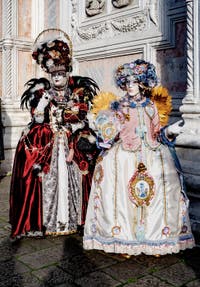 The parade of people in costume at the 2026 Venice Carnival in front of the Church of San Zaccaria.