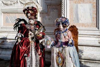 The parade of people in costume at the 2026 Venice Carnival in front of the Church of San Zaccaria.