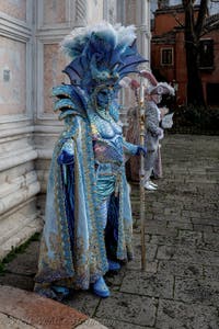 The parade of people in costume at the 2026 Venice Carnival in front of the Church of San Zaccaria.