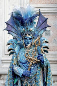 The parade of people in costume at the 2026 Venice Carnival in front of the Church of San Zaccaria.