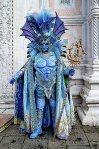 The parade of people in costume at the 2026 Venice Carnival in front of the Church of San Zaccaria.