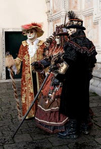 The parade of people in costume at the 2026 Venice Carnival in front of the Church of San Zaccaria.