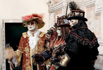 The parade of people in costume at the 2026 Venice Carnival in front of the Church of San Zaccaria.