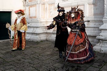 The parade of people in costume at the 2026 Venice Carnival in front of the Church of San Zaccaria.