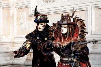 The parade of people in costume at the 2026 Venice Carnival in front of the Church of San Zaccaria.