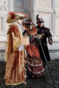 The parade of people in costume at the 2026 Venice Carnival in front of the Church of San Zaccaria.