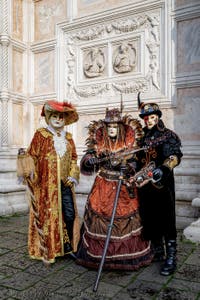 The parade of people in costume at the 2026 Venice Carnival in front of the Church of San Zaccaria.