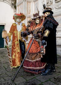 The parade of people in costume at the 2026 Venice Carnival in front of the Church of San Zaccaria.