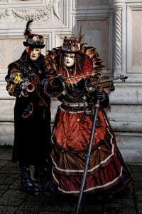 The parade of people in costume at the 2026 Venice Carnival in front of the Church of San Zaccaria.
