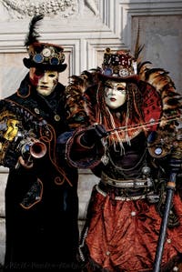 The parade of people in costume at the 2026 Venice Carnival in front of the Church of San Zaccaria.