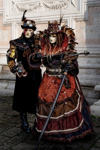The parade of people in costume at the 2026 Venice Carnival in front of the Church of San Zaccaria.