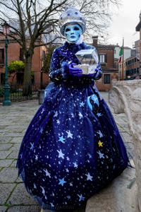 The parade of people in costume at the 2026 Venice Carnival in front of the Church of San Zaccaria.