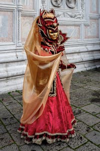 The parade of people in costume at the 2026 Venice Carnival in front of the Church of San Zaccaria.