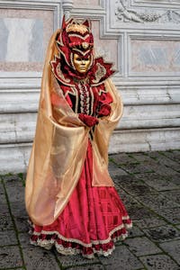The parade of people in costume at the 2026 Venice Carnival in front of the Church of San Zaccaria.