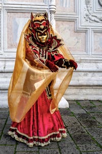 The parade of people in costume at the 2026 Venice Carnival in front of the Church of San Zaccaria.