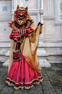 The parade of people in costume at the 2026 Venice Carnival in front of the Church of San Zaccaria.