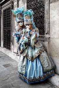 The parade of people in costume at the 2026 Venice Carnival in front of the Church of San Zaccaria.