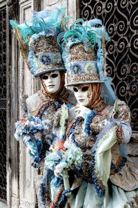 The parade of people in costume at the 2026 Venice Carnival in front of the Church of San Zaccaria.