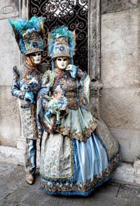 The parade of people in costume at the 2026 Venice Carnival in front of the Church of San Zaccaria.