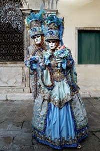 The parade of people in costume at the 2026 Venice Carnival in front of the Church of San Zaccaria.