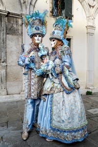 The parade of people in costume at the 2026 Venice Carnival in front of the Church of San Zaccaria.