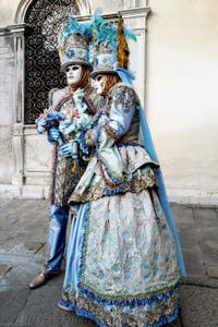 The parade of people in costume at the 2026 Venice Carnival in front of the Church of San Zaccaria.