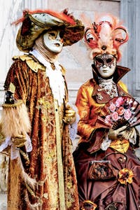 The parade of people in costume at the 2026 Venice Carnival in front of the Church of San Zaccaria.