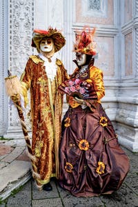The parade of people in costume at the 2026 Venice Carnival in front of the Church of San Zaccaria.