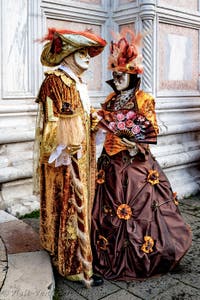 The parade of people in costume at the 2026 Venice Carnival in front of the Church of San Zaccaria.