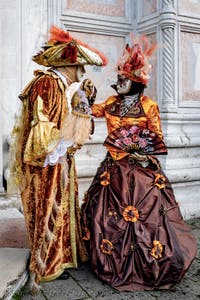 The parade of people in costume at the 2026 Venice Carnival in front of the Church of San Zaccaria.