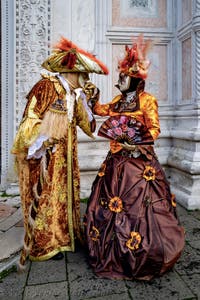 The parade of people in costume at the 2026 Venice Carnival in front of the Church of San Zaccaria.