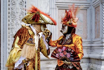 Venice carnival costumed figures