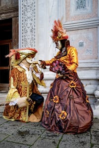 The parade of people in costume at the 2026 Venice Carnival in front of the Church of San Zaccaria.